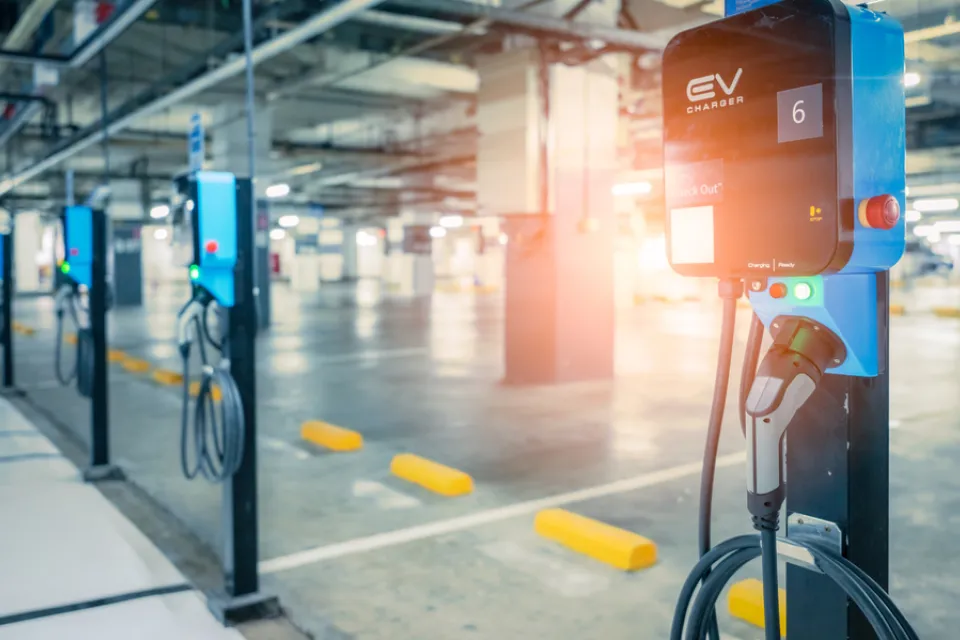 Close-up of row of electric car charging stations in a covered garage structure